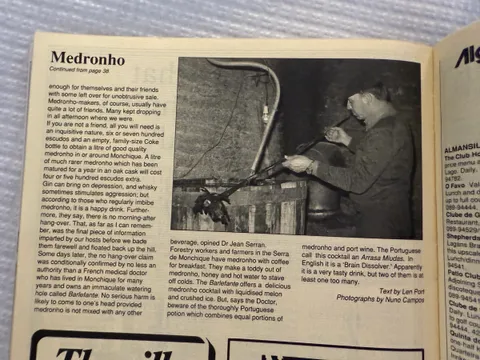 Magazine page 100, the article's continuation, with a photo of a man tending the copper still